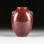 A CHINESE RED FLAMBÉ GLAZED PORCELAIN VASE, QING DYNASTY (1644-1912), of ovoid jar form; a wide