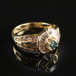 A 14K YELLOW GOLD AND BLUE DIAMOND LADY'S RING, the mounting centering an approximately 0.25 carat