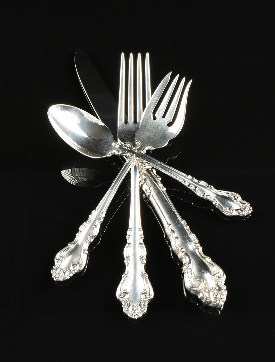 A FIFTY-SEVEN PIECE REED & BARTON STERLING SILVER FLATWARE SERVICE, SPANISH BAROQUE PATTERN, MARKED,