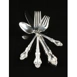 A FIFTY-SEVEN PIECE REED & BARTON STERLING SILVER FLATWARE SERVICE, SPANISH BAROQUE PATTERN, MARKED,