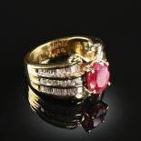 AN 18K YELLOW GOLD, RUBY, AND DIAMOND LADY'S RING, the mounting centering an oval cut ruby