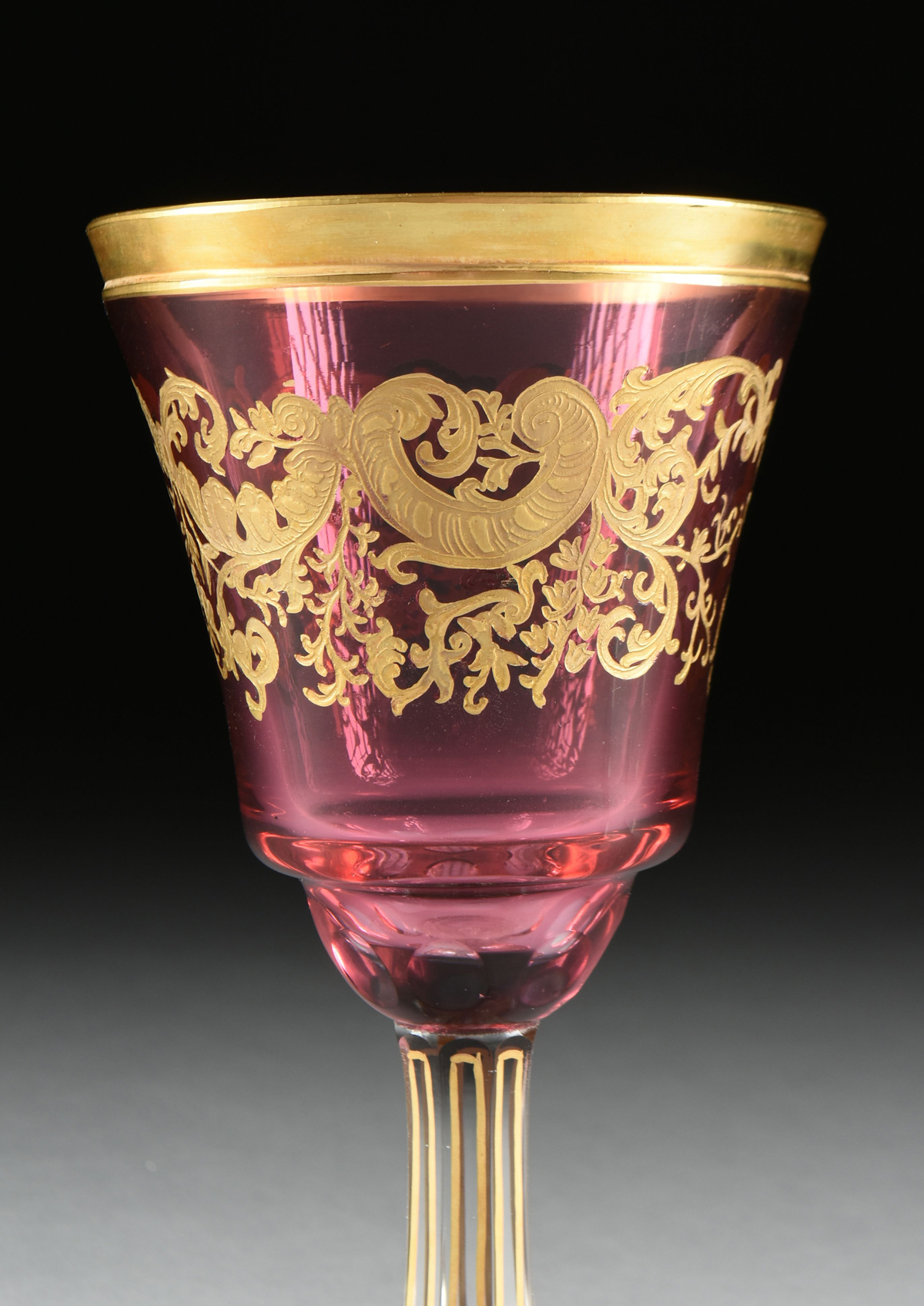 A SET OF FOUR BACCARAT STYLE GILT OVERLAY CRANBERRY TO CLEAR GOBLETS, CIRCA 1900, the gilt rims over - Image 4 of 8