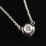 A 14K WHITE GOLD AND DIAMOND LADY'S DROP NECKLACE, the bezel set round diamond weighing