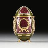 A VIVIAN ALEXANDER RHINESTONE INLAID AND ENAMELED GILT METAL EGG PURSE, LABELED AND NUMBERED, in the