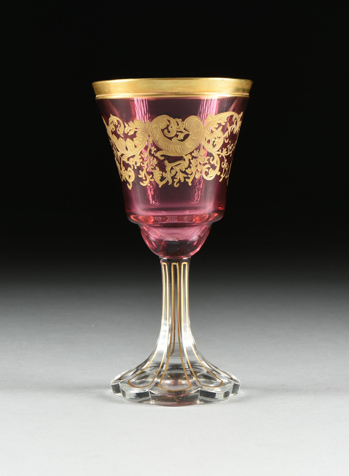 A SET OF FOUR BACCARAT STYLE GILT OVERLAY CRANBERRY TO CLEAR GOBLETS, CIRCA 1900, the gilt rims over - Image 3 of 8