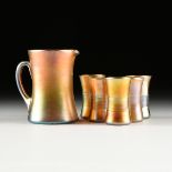 AN ASSEMBLED SIX PIECE LOUIS COMFORT TIFFANY FAVRILE GLASS PITCHER AND TUMBLER SET, ENGRAVED