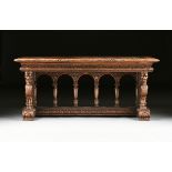 AN ITALIAN RENAISSANCE REVIVAL CARVED WALNUT LIBRARY TABLE, EARLY 20TH CENTURY, the rectangular