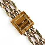 AN 18K YELLOW GOLD AND TIGER'S EYE PIAGET LADY'S WRISTWATCH, the square case stamped "9200 159927"