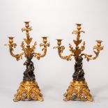 Pair of Patinated and Dore Bronze Figural Candlesticks, France, 19th century, each three light
