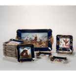 Assembled Twenty-one-piece Haviland Limoges Porcelain Game Set, France, c. 1880, gilt trim to a dark