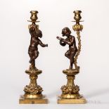 Pair of Dore and Patinated Bronze Figural Candlesticks, France, late 19th/early 20th century, each