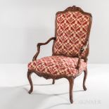 Louis XV Fauteuil, France, 18th century, shaped crest rail carved with floral motifs, curved