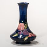 Moorcroft Pottery Wisteria Design Vase, England, c. 1925, polychrome enameled to a dark blue ground,