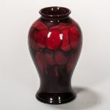 Moorcroft Pottery Wisteria Design Flambe Vase, England, c. 1930, decorated in shades of red,