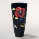 Moorcroft Pottery Clematis Design Vase, England, c. 1955, polychrome enameled flowers to a dark blue