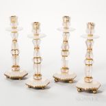 Set of Four Rock Crystal Candlesticks, 20th century, each with octagonal and hexagonal cut mounts