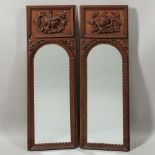Pair of Carved Oak Mirrors, late 19th/early 20th century, decorated with carved panels on