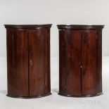 Pair of George III Mahogany and Mahogany-veneered Hanging Bow-front Corner Cabinets, England, late