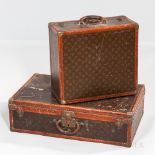 Two Louis Vuitton Suitcases, France, 20th century, case with printed "LV" mark canvas with leather