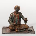 Austrian Cold-painted Bronze Figure of a Trinket Seller on a Carpet, early 20th century, modeled
