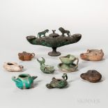 Group of Roman and Persian Oil Lamps, in pottery and metal. Estimate $600-800 The absence of a