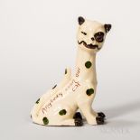 Watcombe Pottery Winker Cat, England, c. 1900, slip decorated cream-colored body, set with one glass