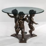 Center Table with Dancing Putti Base, 20th century, bronze patinated cast metal figures supporting a