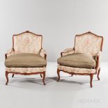 Pair of Louis XV-style Beechwood Bergeres, 20th century, shaped crest rails, carved armrest