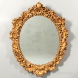 Pair of Carved and Gilded Oval Mirrors, probably Italy, late 19th/early 20th century, frame with