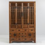 Elmwood Compound Cupboard, China, 20th century, upper case with two spindle-paneled doors flanked b