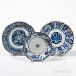 Three Export Blue and White Plates, Japan, 18th/19th century, a lobed dish with floral roundel and