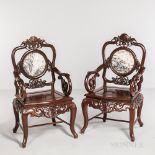 Pair of Hardwood Armchairs, China, late 20th century, with trapezoid seat, foliate scroll armrests