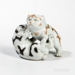 White-glazed Porcelain Figurine of Two Puppies Wrestling, Japan, 19th/20th century, with enameled d