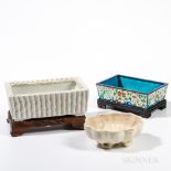 Three Planters, China, an oval lotus-inspired cream-glazed pottery planter; a rectangular bamboo-in