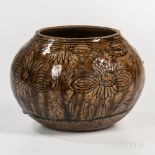 Brown-glazed Stoneware Jar, Southeast Asia, incised with stylized floral design, bisque bottom and