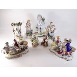 Eight various bisque or porcelain figure groups