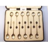 A silver set of twelve coffee bean spoons in fitted case (one with terminal missing) Birmingham 1923
