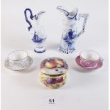 An Ashford porcelain box, two Spode miniature teacups and saucers and two Delft jugs