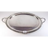 An silver plated oval tray with scrollwork decoration