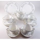 A Duchess Harebell tea service comprising four cups and saucers, two cake plates, milk and sugar