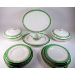 An Alfred Meakin 1930's green and gilt banded dinner service comprising two tureens, three graduated