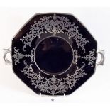 A black glass cake plate with silver inlay