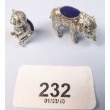 A silver wild boar miniature pin cushion and a teddy one