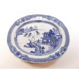 An 18th century Chinese blue and white meat plate painted landscape - 38.5cm wide