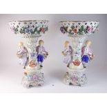 A pair of 20th century 'Dresden Royale' table centrepieces with floral clad baskets and pair of