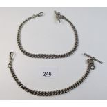 A silver watch chain and a white metal one