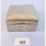 A silver clad square cigarette box
