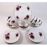 A Colclough tea service comprising six cups and saucers, jug, sugar, six tea plates and cake plate