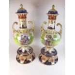 A pair of large pottery vases and covers with printed decoration of country scenes with figures,