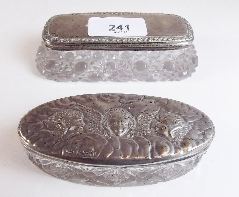 Two cut glass and silver dressing table boxes - one embossed angels heads